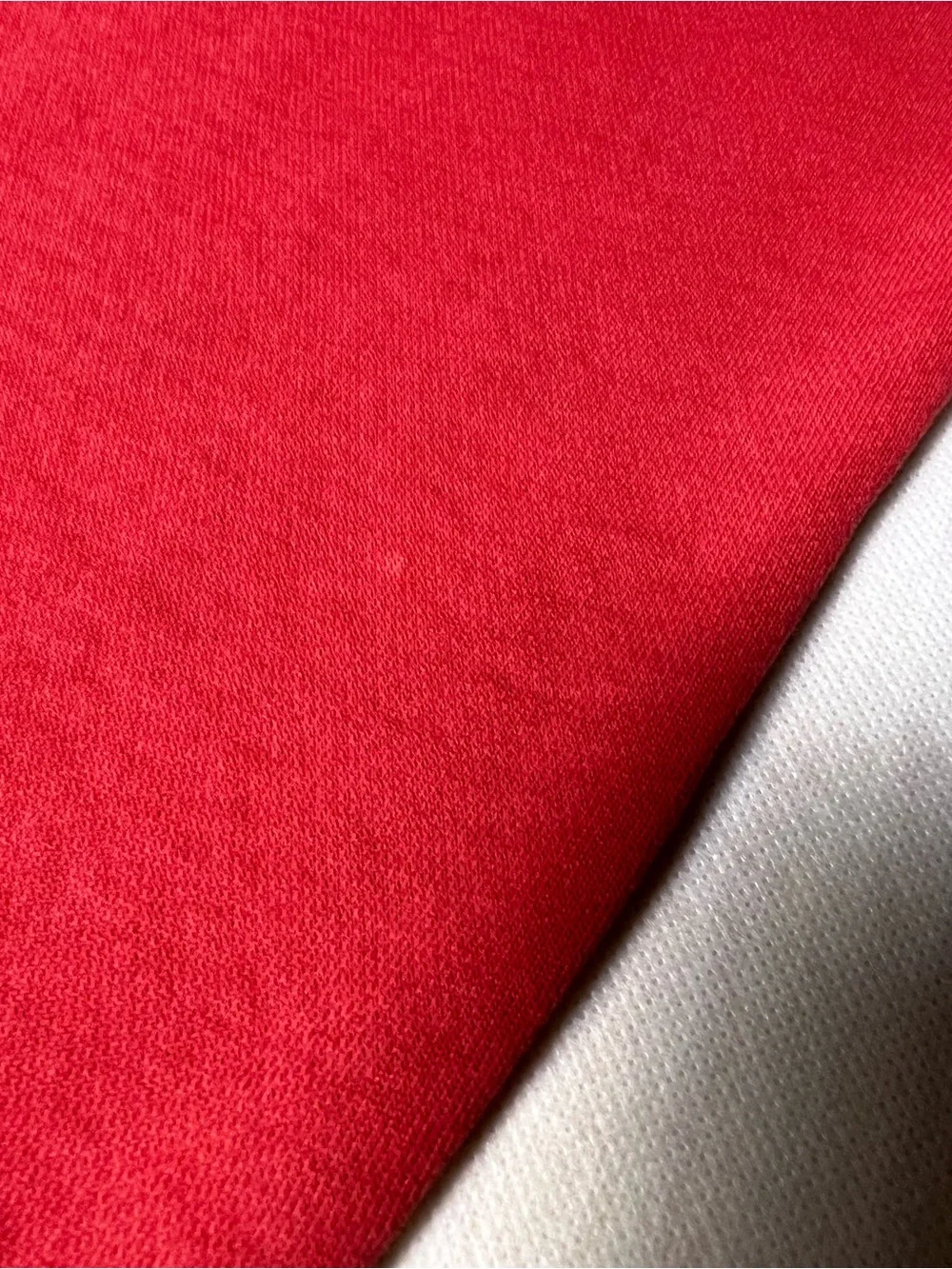 Hollister Co. red sweatpants with white vertical text reading 'HOLLISTER'